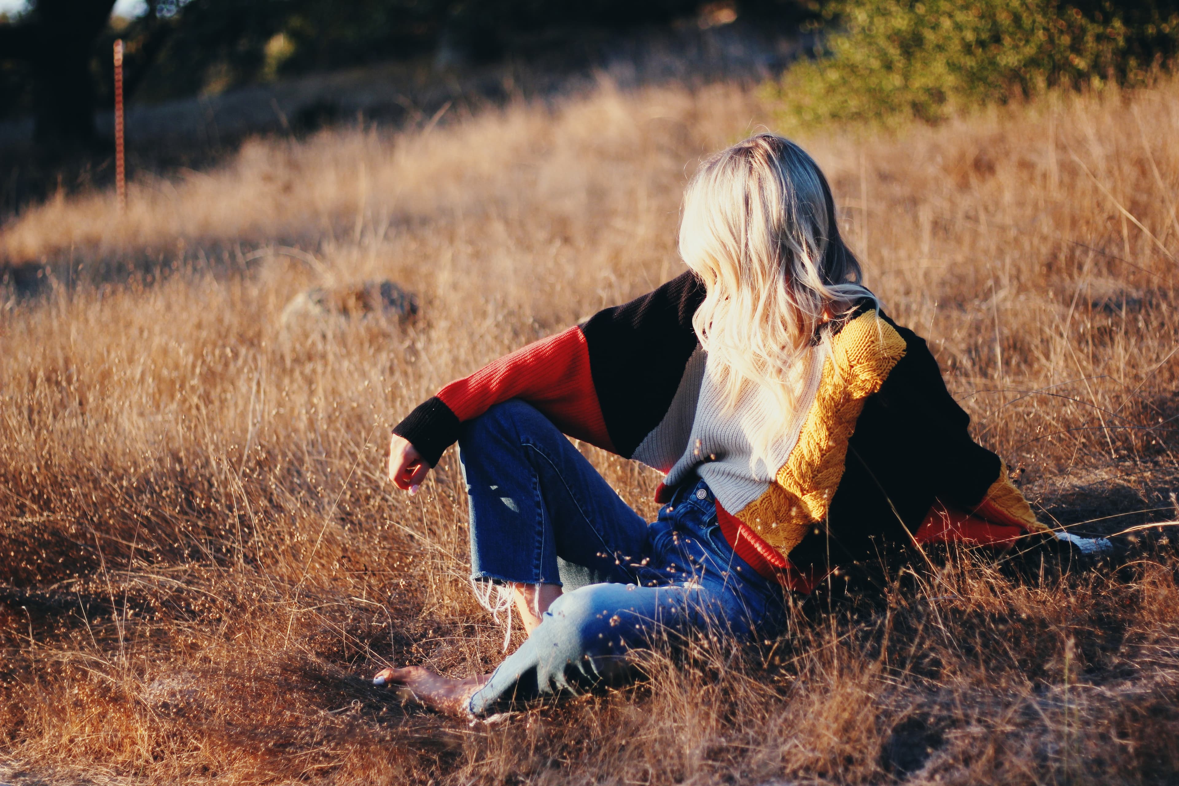 Woman in field at sunset